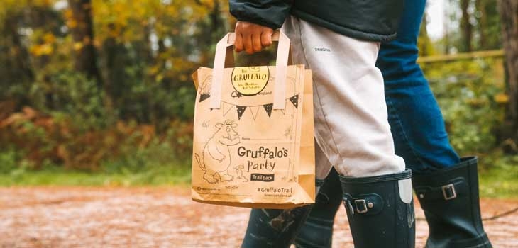 People walking with a Gruffalo Party Trail pack